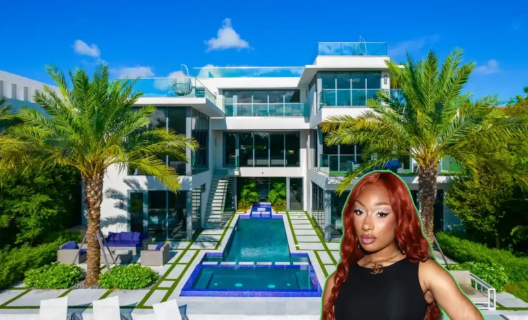 Modern exterior of Megan Thee Stallion house in LA's San Fernando Valley, featuring sleek lines, pool, and gated entry.